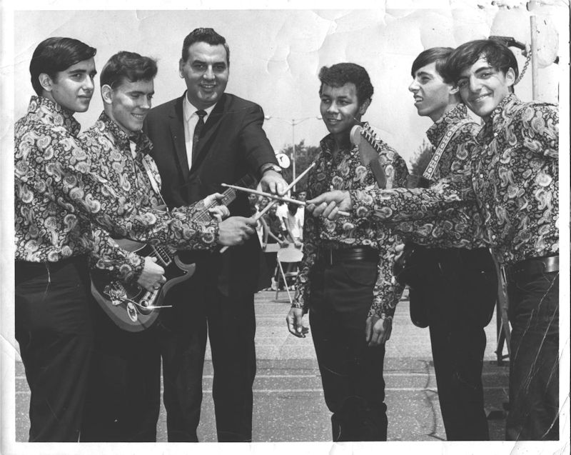 The Younger Generation at the Battle of Bands contest at the Mid Island Shopping Plaza, Hicksville, Long Island, 1967. Left to right, Johnny Rosolino (lead vocals), Jim Dean (guitar, vocals), Ralph Marino (lawyer from Oyster Bay, future New York State senator), Louis Mayhew (lead vocals), Alan Galasso (guitar), Roland Donisi (drums)